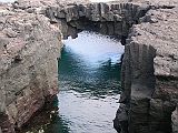 Galapagos 6-1-13 Santiago Puerto Egas Collapsed Lava Tube The collapsed lava tubes open to the sea and with clear water and natural arches are the best place to see the Galapagos fur seals, which rest here under the shady overhangs, or loll about in the turquoise pools.